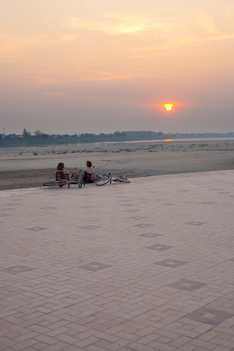 Foreign Tourists Mekong River Sunset Bicycles - Vientiane, Laos - Daily Travel Photos