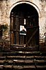 Door Decoration Photo: Chairman Mao hangs precariously by a single nail to a rickety door.