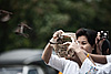 Release (Songkran Festival Part IV) Photo: Early morning, followers of Buddhism free birds to celebrate the Thai new year during the Songkran Festival.