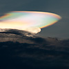 Top Cloud Photo: A cloud refracts the sunset making it appear uniquely rainbow colored.