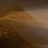 Misty Morning (Caldera I) Photo: Wind sweeps mist from the edge of town into Mt. Bromo's Caldera.