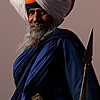 Gurdwara Head Photo: The leader (or head) of the Paonta Sahib Gurdwara appears menacing with weapons drawn.  Contrary to the impression left by this image, this man, like most Sikhs I've met, is one of the classiest, kindest, gentlemen in all of India.  Despite the fierce stance, you can see the gentle grin poking through his salt and pepper beard.