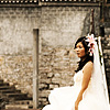photo: Smoggy Ceremonies - A bride stands for photos on a footbridge over the Li River.