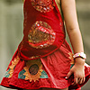Red Thread Photo: Cute Chinese tourist in a red handkerchief top and skirt.