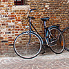 Fittingly Flanders Photo: Bicycles parked outside a traditional brick building.