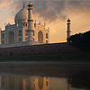 Monolithic Monument Photo: The Taj Mahal, seen from the holy Jamuna river, is reflected on the water's surface at sunset.  (From the archives due to time restraints.)