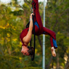 photo: Street Performer Festival Acrobatics - A woman performs dance-like maneuvers suspended in mid-air.