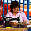 photo: Street Sewing - One of many curb-side sewing services offered around Bangkok.