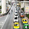 Skytrain Traffic Photo: Downtown traffic under the snaking sky-train mass transportation system in Bangkok.