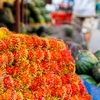 Hairy Heap Photo: A neatly piled stack of rambutan fruits at a local market in Bangkok.